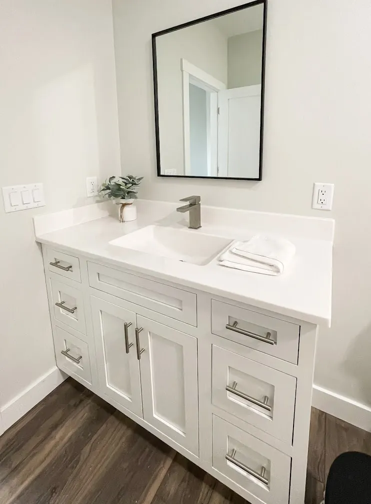 Onyx Collection vanity top with an integrated sink on a white single vanity (manufacturer photo)