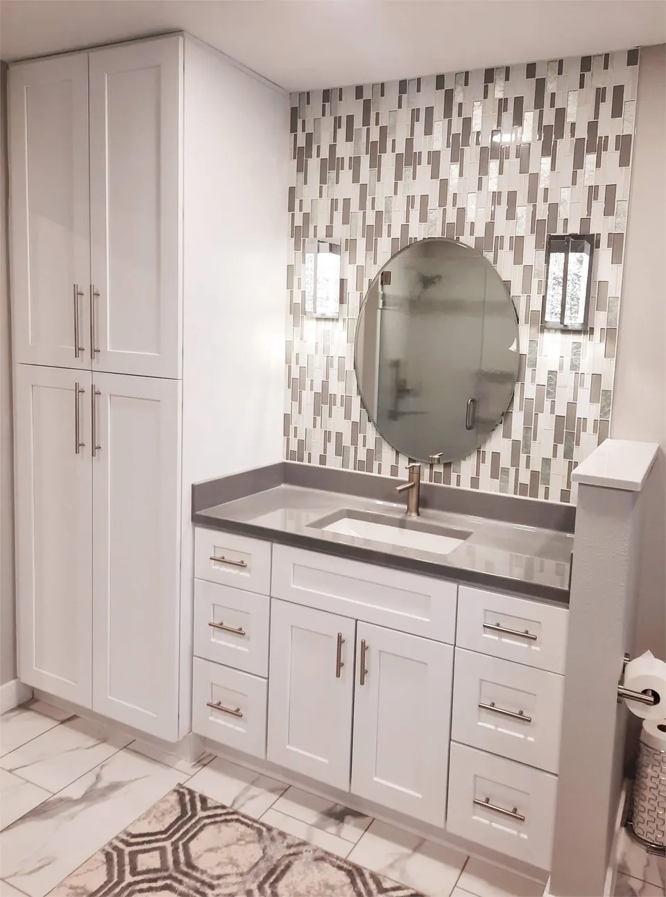 Onyx Collection vanity top with a linen tower and mosaic tile wall (manufacturer photo)