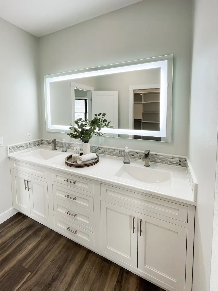 Onyx Collection solid-surface double vanity top on a white cabinet (manufacturer photo)